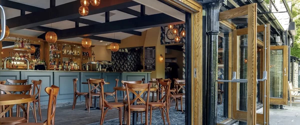 The Boathouse Inn indoor and outdoor seating with riverside setting